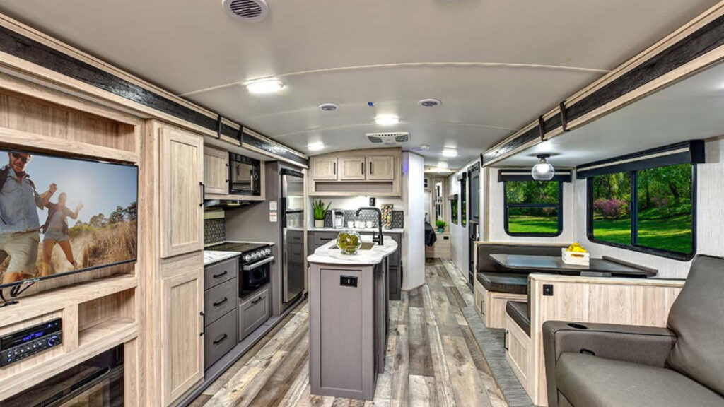 The kitchen and living area in one of the best cold weather motorhomes, a Heartland Sundance Ultra-Lite 262RB.
